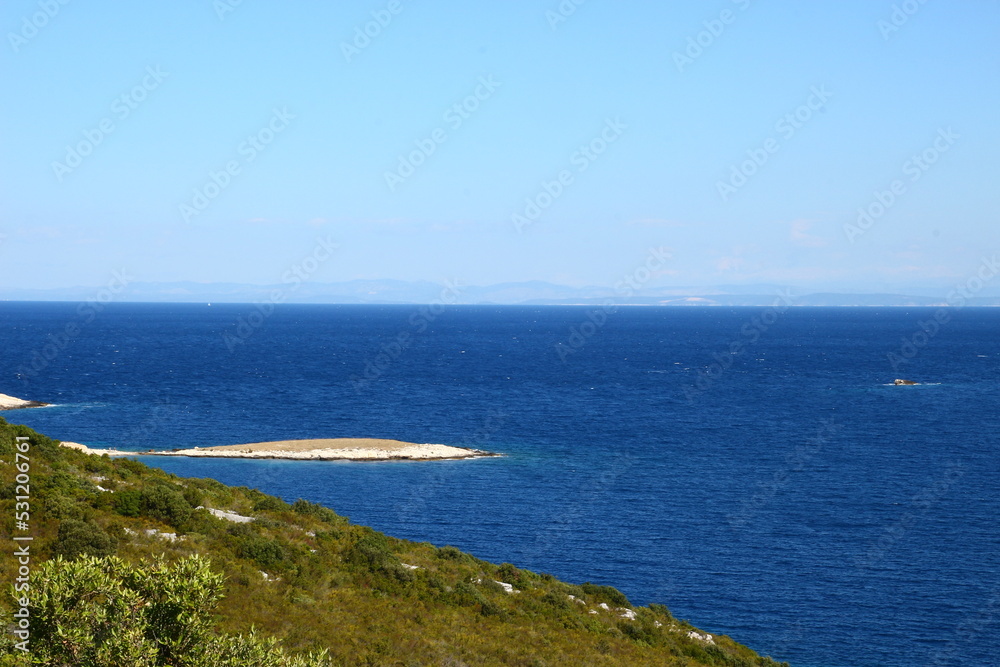 The landscape of the island of Vis, rocky beaches, steep cliffs, lonely islands

