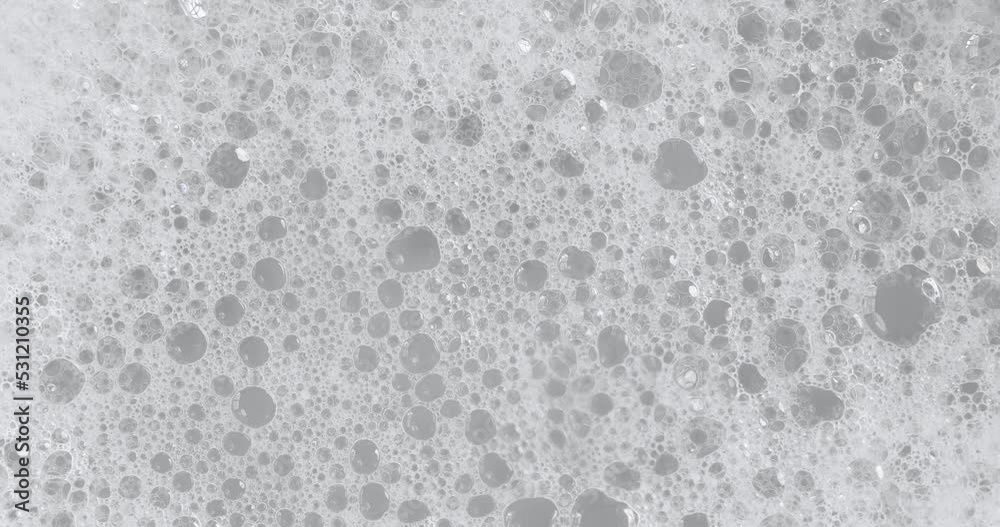 Close up cleansing white foam texture while using surfactant washing, cleaning concept