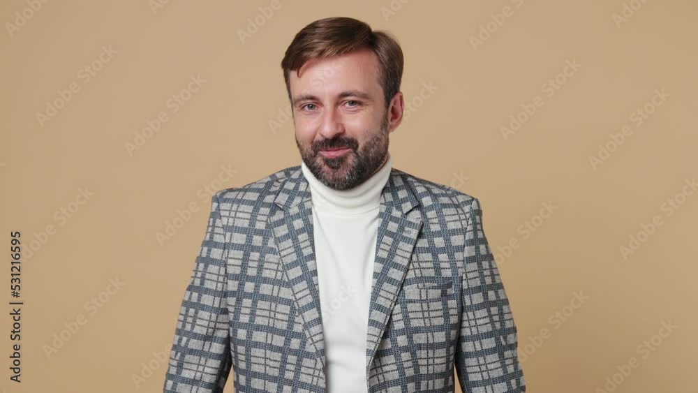 Young shy shamed employee business man corporate lawyer 30s wear classic grey suit jacket spread hands say oops ouch oh omg i am so sorry work in office isolated on plain pastel light beige background Young shy shamed employee business man corporate lawyer 30s wear classic grey suit jacket spread hands say oops ouch oh omg i am so sorry work in office isolated on plain pastel light beige background