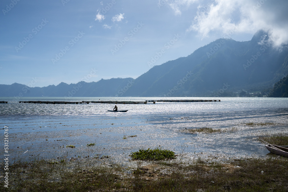 Batur mountain view, volcano, river, cloud, sunny day, Bali Indonesia