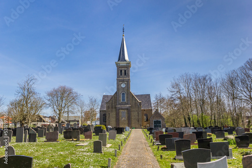 Historic Nicolaaskerk church and graveyard of Hemelem, Netherlands photo