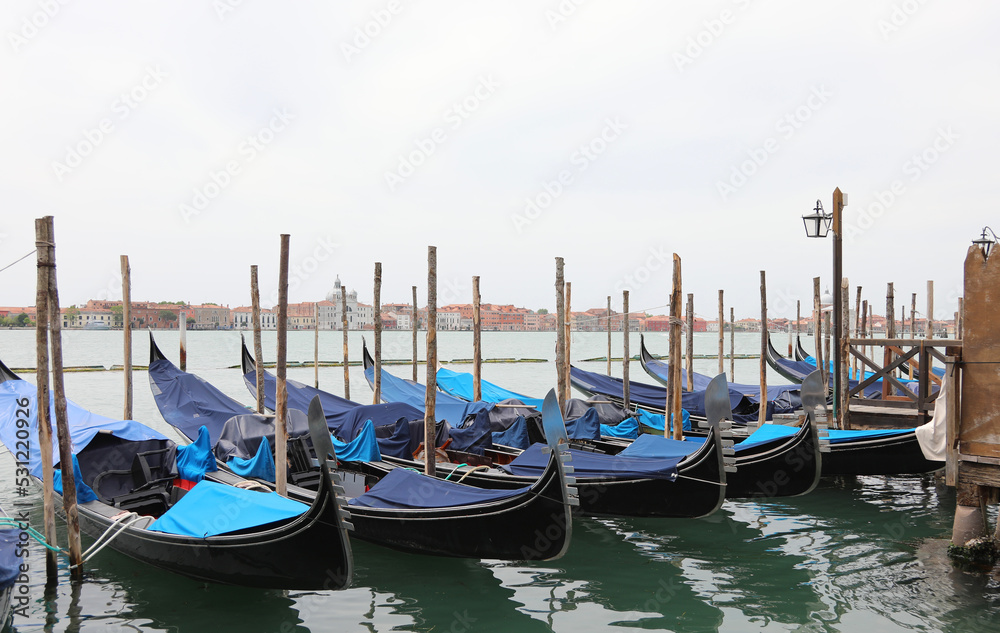 Gondolas the typical tourist boats of Venice - Italy without people during the lockdown