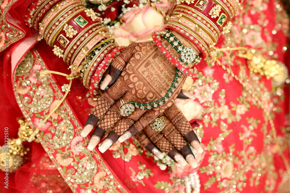Beautiful Bridal Hands with Henna Tattoo and Bridal Jewellery 