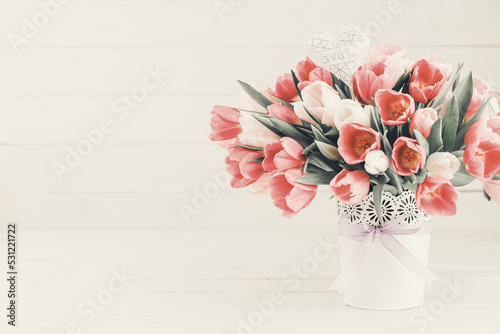 Pink tulip on the white background. Easter background