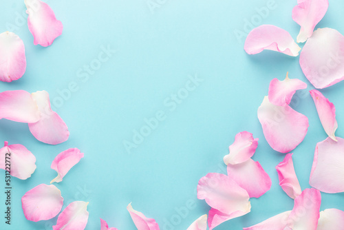 Fototapeta Naklejka Na Ścianę i Meble -  Rose flowers petals on pastel background. Valentines day background. Flat lay, top view, copy space.