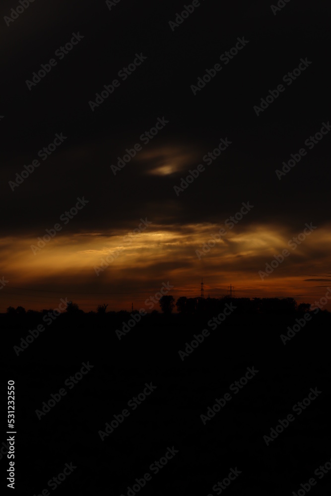 Beautiful sunset with orange and yellow clouds