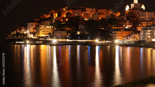 City on a mountain with a sea and light