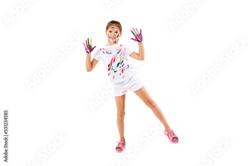 little child girl with hands painted in colorful paint
