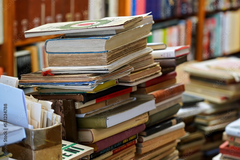 Stacks of many old used books displayed at local antiquarian bookshop Stacks of many old used books displayed at local antiquarian bookshop