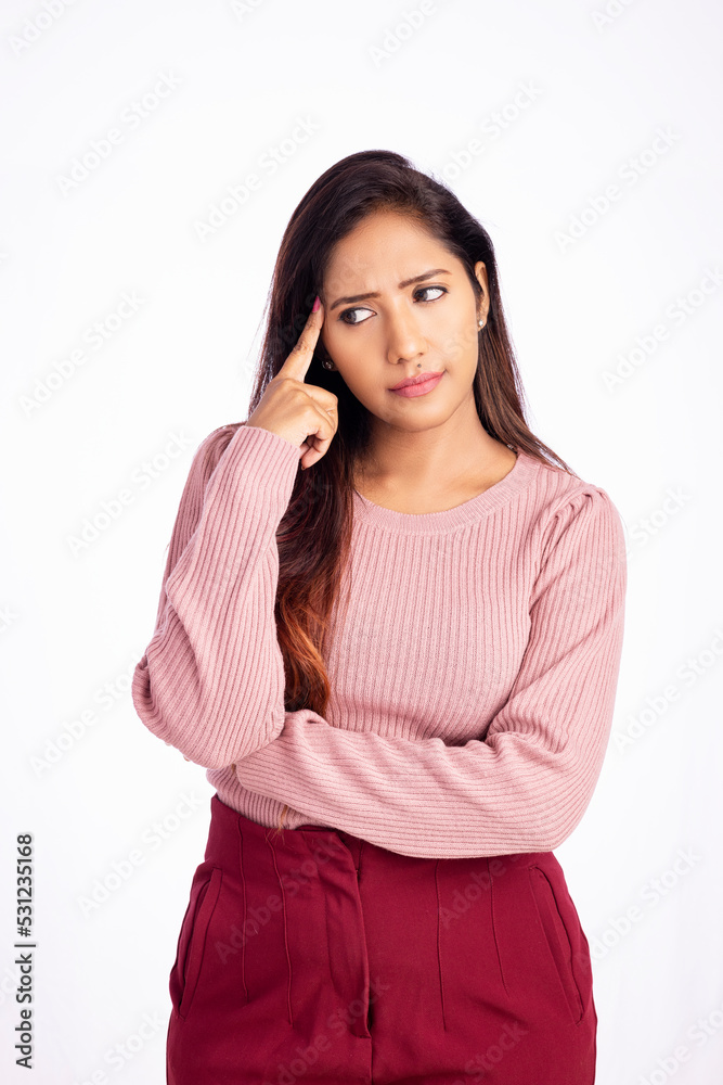 Worried young woman thinking on white background. Worried young woman thinking on white background.