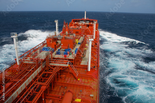 A merchant ship is underway at sea, view from the bridge wings photo