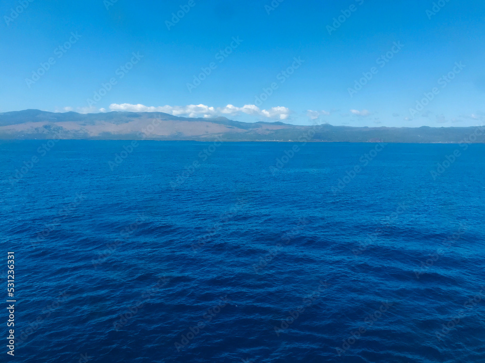 Fototapeta premium A merchant ship approaching Comores Island
