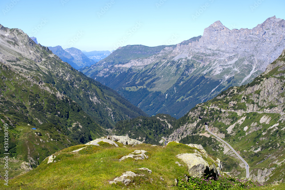 Beautiful scenic view of mountain panorama with mountain pass road at Swiss mountain pass Sustenpass on a sunny summer day. Photo taken July 13th, 2022, Susten Pass, Switzerland.