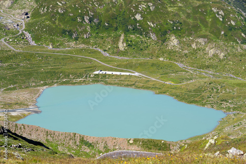 Glacier lake of Stoen Glacier at region of Swiss mountain pass Sustenpass on a sunny summer day. Photo taken July 13th, 2022, Susten Pass, Switzerland. photo