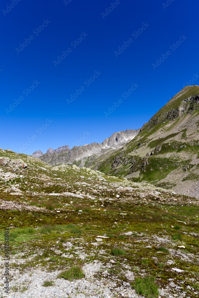 Beautiful aerial view over Gadmer Valley, Canton Bern, at Swiss mountain pass on a sunny summer day. Photo taken July 13th, 2022, Susten Pass, Switzerland.