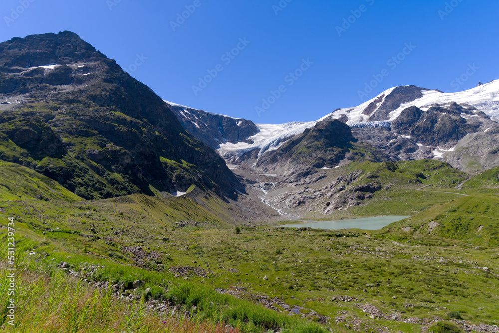 Beautiful scenic view of Stone Glacier with glacier lake at Swiss mountain pass Sustenpass on a sunny summer day. Photo taken July 13th, 2022, Susten Pass, Switzerland.