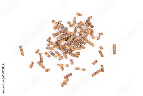 Animal feed. Sunflower granulated feed  on white background, close-up. Animal cattle food pellets. Heap of animal feed pellets  on white background. photo