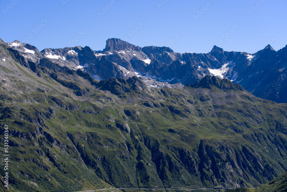 Fototapeta premium Beautiful mountain panorama at Swiss mountain pass Sustenpass with Meien Valley on a sunny summer day. Photo taken July 13th, 2022, Susten Pass, Switzerland.