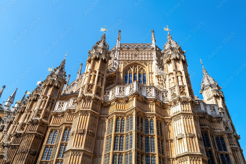 Westminster Abbey, London, famous as the site of many Royal weddings, coronations and burials. Detail of this medieval building against blue sky background.