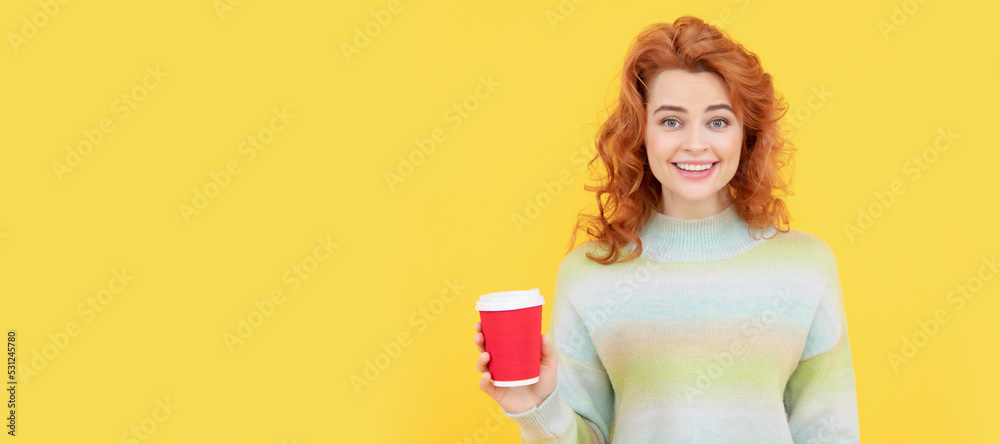 charming redhead woman face portrait drink coffee from paper cup on yellow background, good morning. Woman isolated face portrait, banner with copy space. charming redhead woman face portrait drink coffee from paper cup on yellow background, good morning. Woman isolated face portrait, banner with copy space.