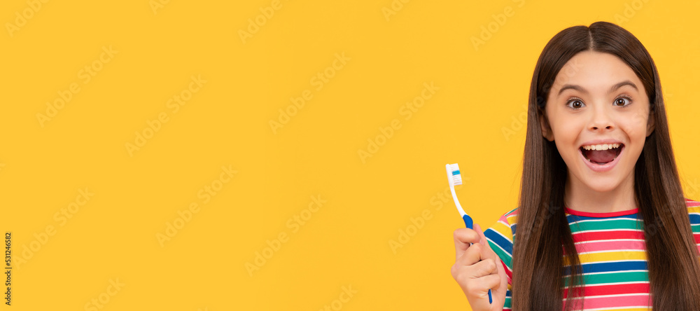 Surprising benefits of oral hygiene. Surprised girl hold tooth brush and apple. Tooth care. Banner of child girl with teeth brush, studio portrait, header with copy space. Surprising benefits of oral hygiene. Surprised girl hold tooth brush and apple. Tooth care. Banner of child girl with teeth brush, studio portrait, header with copy space.
