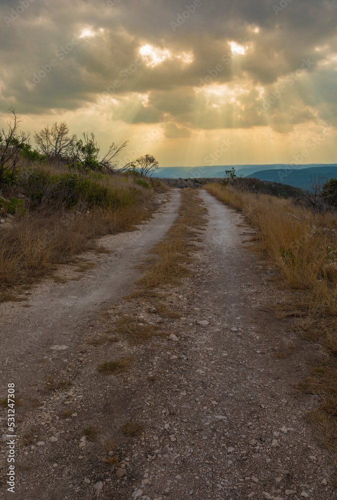 Storm headed toward a gravel road in Texas Hill Country Storm headed toward a gravel road in Texas Hill Country