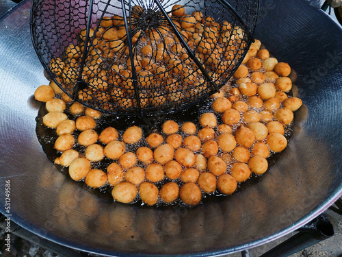 Cooking Sweet potato ball or Thai call Khanom khai nok kratha. made from sweet potatoes and flour mold ball sphere photo