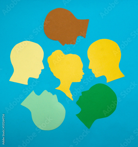 a woman as a leader, people around her, she is a central figure in the business and a real manager, paper people, flat lay
