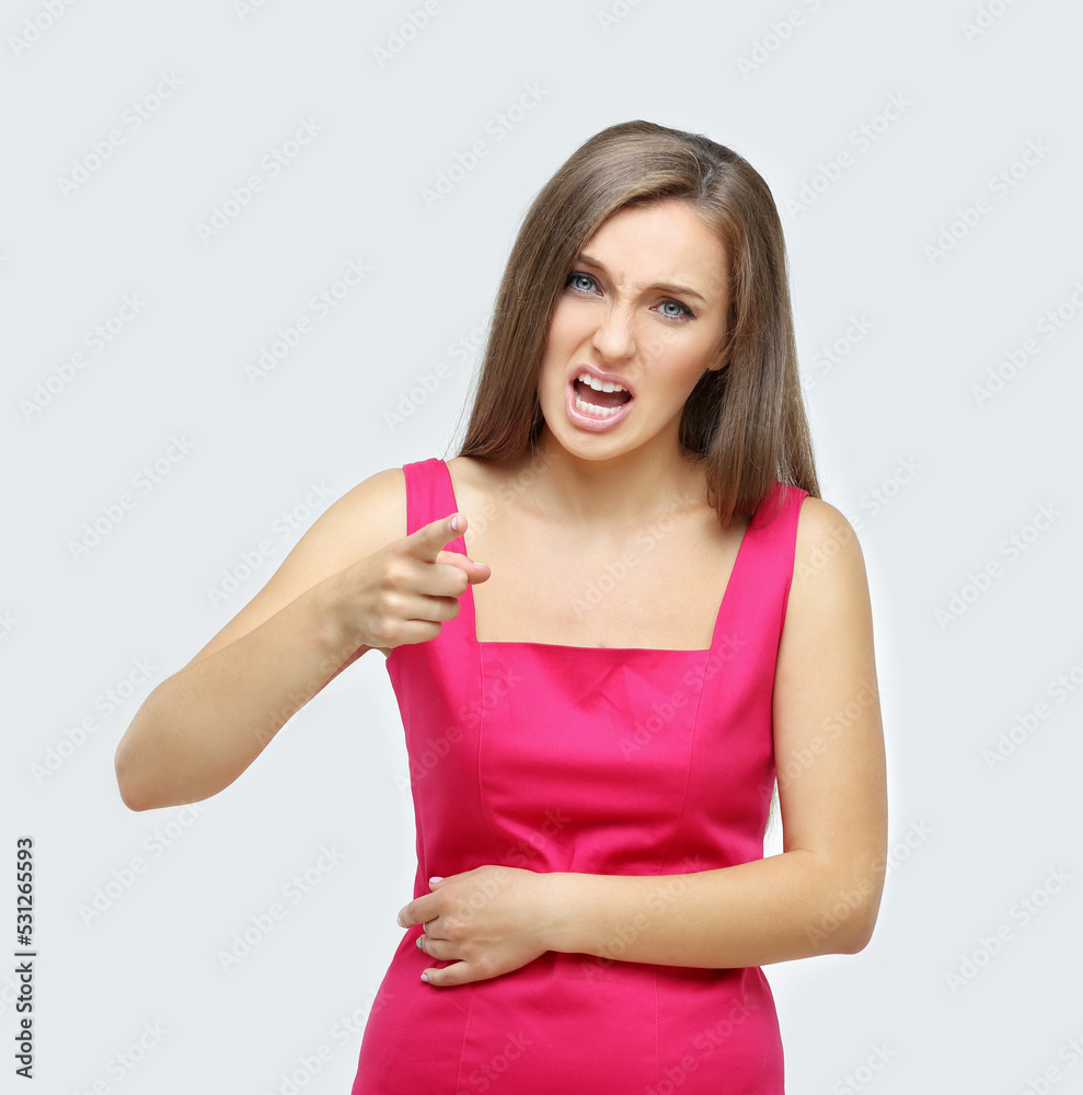 angry nervous girl screaming and pointing her finger angry nervous girl screaming and pointing her finger