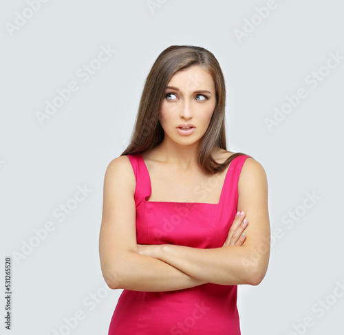 Portrait of confused young woman complaining
