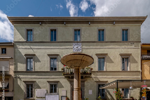 The fountain and the town hall in the Municipio square in Tuoro sul Trasimeno, Perugia, Italy  photo