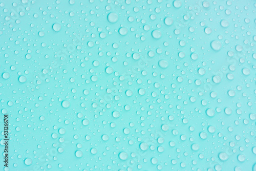 Water drops on blue pastel color background