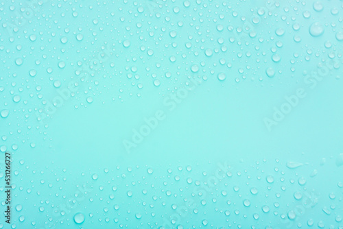 Water drops on blue pastel color background
