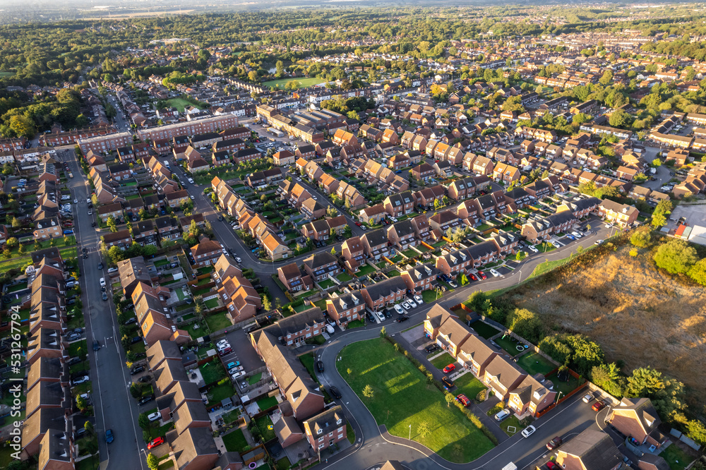 Top down aerial view of houses and streets in a residential area UK New Build Estate Agent House Prices 2022