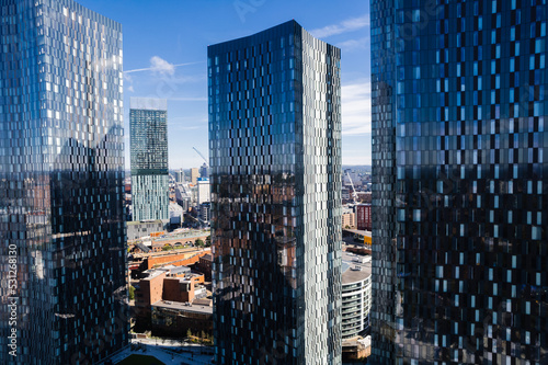 Fotografie, Obraz Manchester City Centre Drone Aerial View Above Building Work Skyline Construction Blue Sky Summer Beetham Tower Deansgate Square Glass Towers