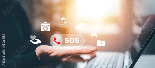 Man hand hold SOS Emergency app in home, call phone, Chat message icon, Emergency application from smartphone for elderly, technology concept.Old hand touch mobile phone and call for help.