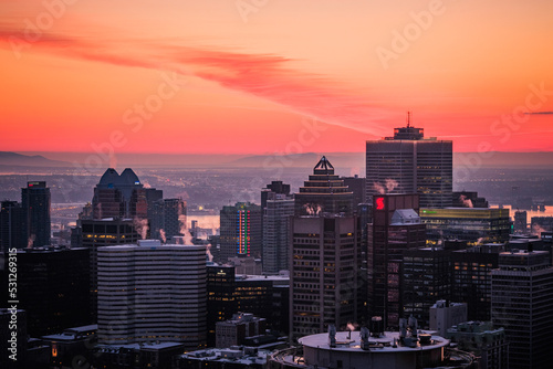 View on the Montreal skyline at sunrise on a cold winter day from the Mount Royal (Quebec, Canada)