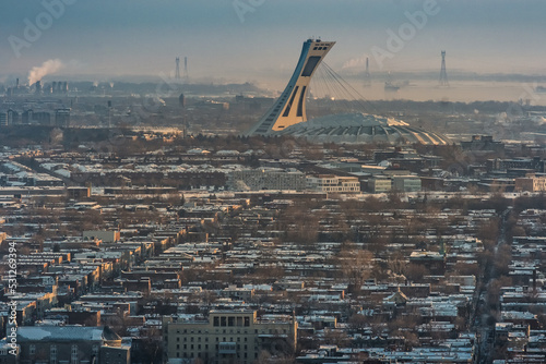 view on the Montreal Olympic stadium at sunrise in winter from Mount Royal (Quebec, Canada) photo