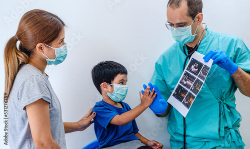 Mother and child check hand with doctor promising to respect doctor's treatment. Health care concept.