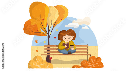 Little girl reads book in the park