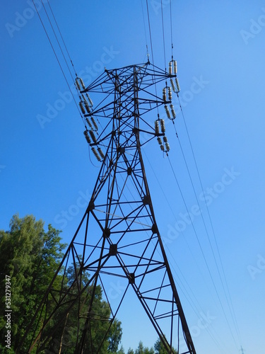 Power line, high-voltage electricity transmission tower against the sky, industrial background, wallpaper