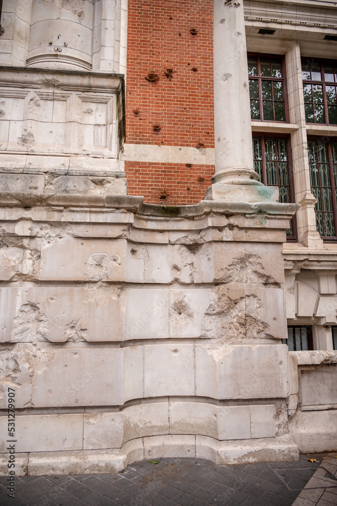 Exterior detail with world war 2 bomb damage at the Victoria and Albert Museum in the Kensington area of London. Exterior detail with world war 2 bomb damage at the Victoria and Albert Museum in the Kensington area of London.