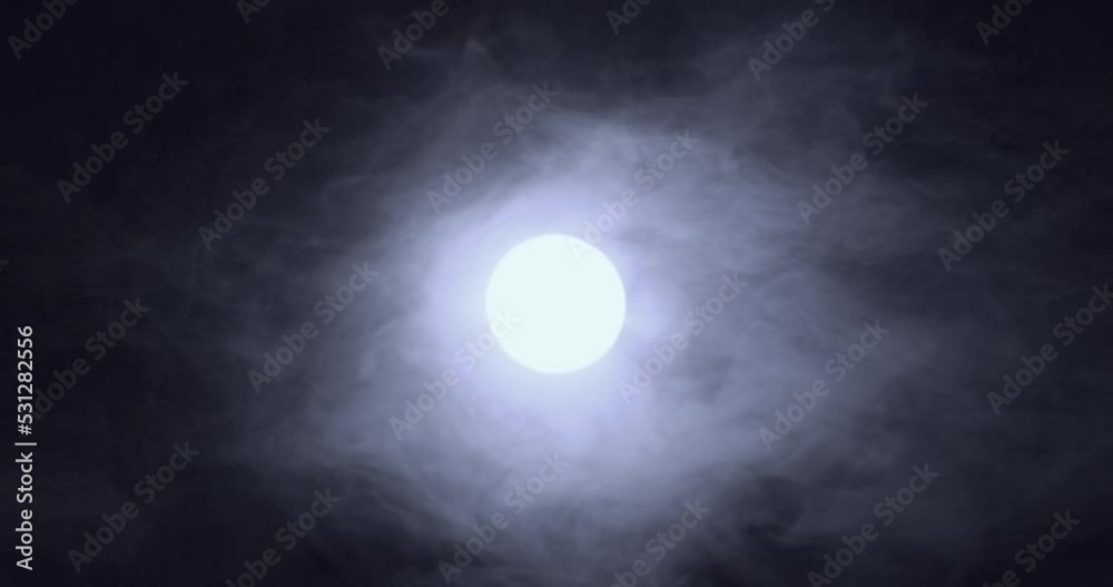 Clouds moving through the moon, Halloween hell sky concept
