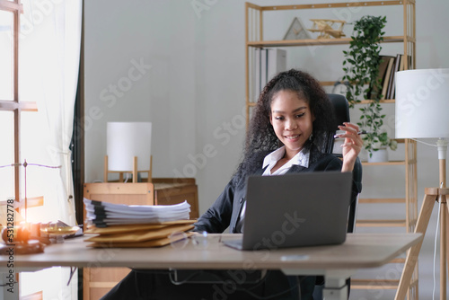cheerful smiling business woman sitting at the office happy african american businessman in office