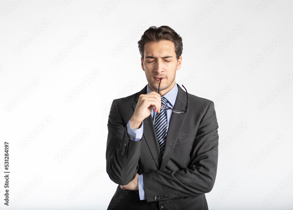 Close up portrait of thoughtful handsome business man in black suit isolated on white background Close up portrait of thoughtful handsome business man in black suit isolated on white background