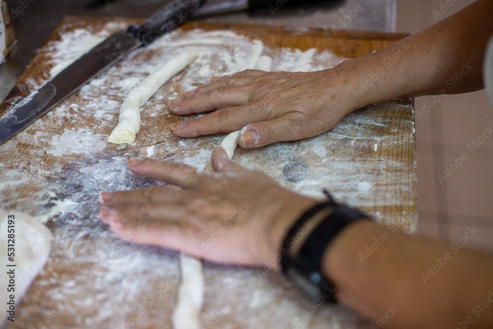 baker kneading dough