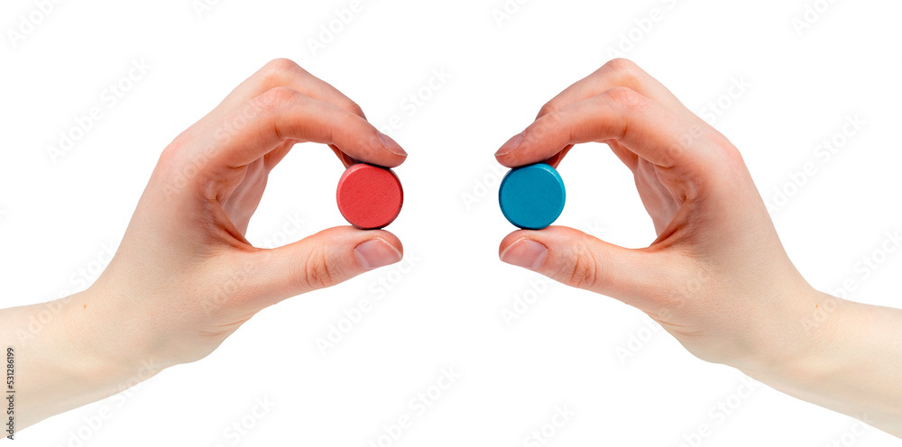 Hands holding red and blue pills isolated on white background. Choice between two options, truth, reality and illusion. Matrix, conspiracy concept. Hands holding red and blue pills isolated on white background. Choice between two options, truth, reality and illusion. Matrix, conspiracy concept.