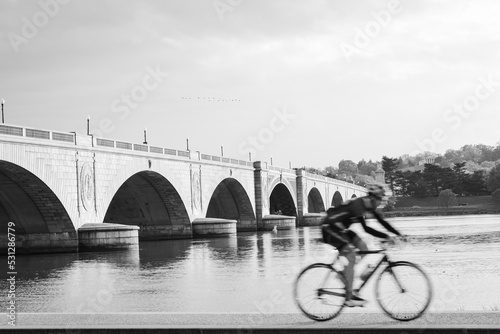 A biker and Memorial Bridge in black and white - Washington DC United States