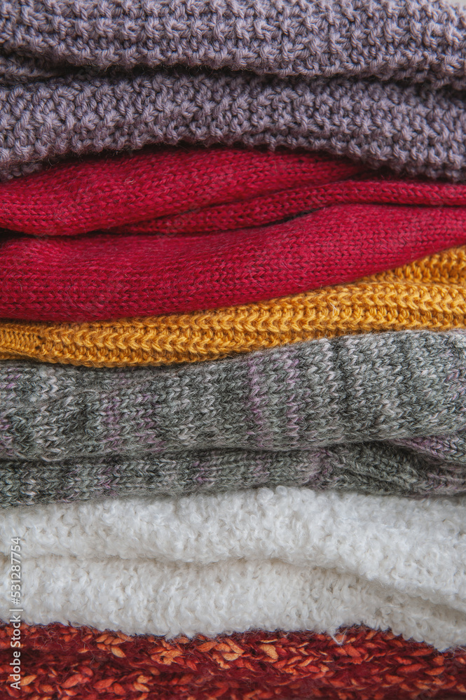 Autumn and winter background with knitted colourful sweaters Autumn and winter background with knitted colourful sweaters
