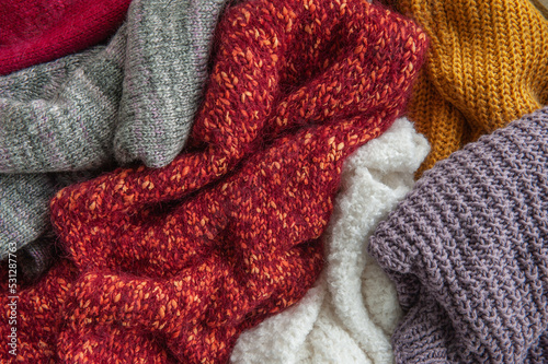 Autumn and winter background with knitted colourful sweaters